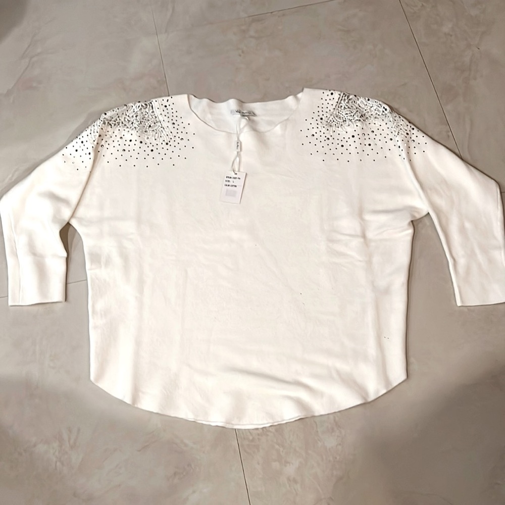 Sweater with cut out lace shoulder and studs for dressy design. NWT
